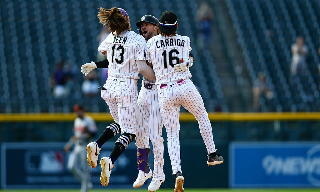 DENVER, CO - SEPTEMBER 2: Brett Sullivan #26 of the Colorado Rockies celebrates his walk-off, two-run single with Zac Veen #13 and Cole Carrigg #16 to for a 6-5 win in 11 innings against the Baltimore Orioles at Coors Field on September 2, 2026 in Denver, Colorado.