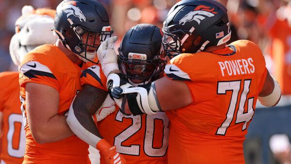 DENVER, COLORADO - SEPTEMBER 20: Nate Adkins #45, Jonah Coleman #20, and Ben Powers #74 of the Denver Broncos celebrate after Coleman's rushing touchdown against the Jacksonville Jaguars in the fourth quarter of a game at Empower Field At Mile High on September 20, 2026 in Denver, Colorado.