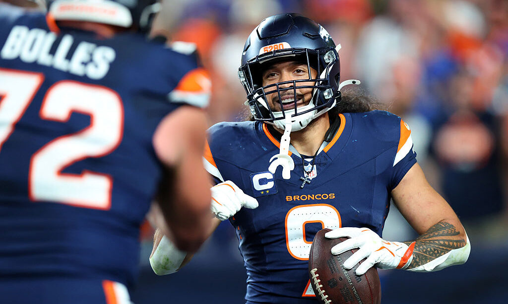 DENVER, COLORADO - SEPTEMBER 27: Talanoa Hufanga #9 of the Denver Broncos celebrates an interceptio...