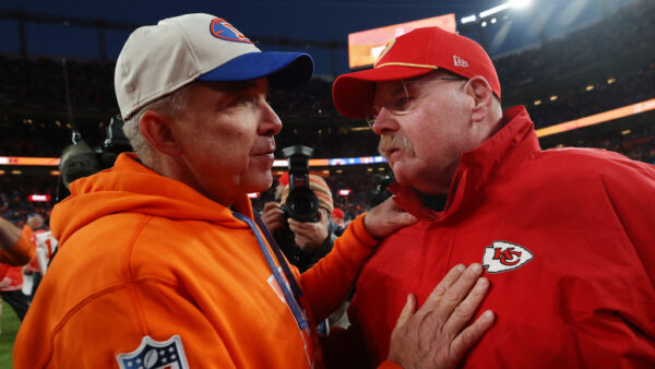 DENVER, COLORADO - JANUARY 05: Head coach Sean Payton of the Denver Broncos and head coach Andy Reid of the Kansas City Chiefs meet after the Broncos beat the Chiefs 38-0 at Empower Field At Mile High on January 05, 2025 in Denver, Colorado.