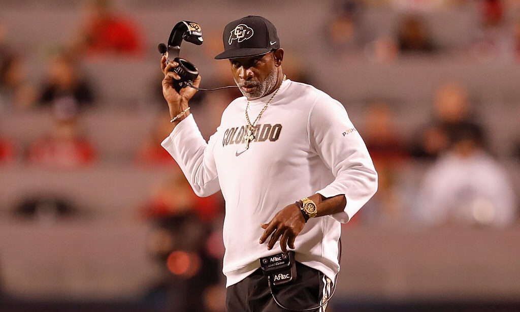 SALT LAKE CITY, UT - OCTOBER 25: Head coach Deion Sanders of the Colorado Buffaloes takes off his head set during the first half of their game against the Utah Utes at Rice Eccles Stadium on October 25, 2025 in Salt Lake City, Utah.