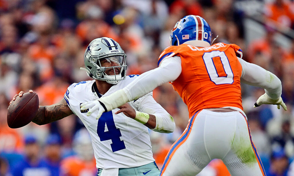 DENVER, COLORADO - OCTOBER 26: Jonathon Cooper #0 of the Denver Broncos pressures Dak Prescott #4 of the Dallas Cowboys during the third quarter in the game at Empower Field At Mile High on October 26, 2025 in Denver, Colorado.