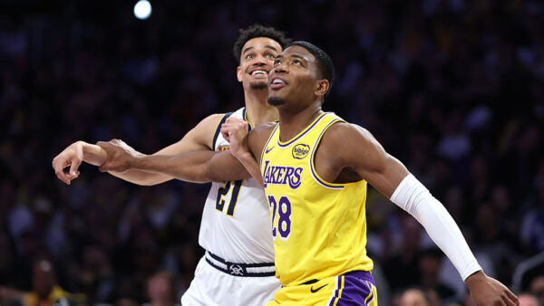 LOS ANGELES, CALIFORNIA - MARCH 14: Spencer Jones #21 of the Denver Nuggets battles Rui Hachimura #28 of the Los Angeles Lakers for position during the second half of a game at Crypto.com Arena on March 14, 2026 in Los Angeles,