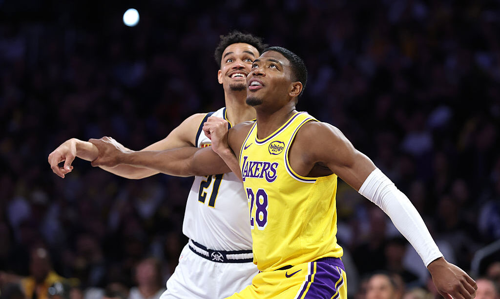 LOS ANGELES, CALIFORNIA - MARCH 14: Spencer Jones #21 of the Denver Nuggets battles Rui Hachimura #28 of the Los Angeles Lakers for position during the second half of a game at Crypto.com Arena on March 14, 2026 in Los Angeles,