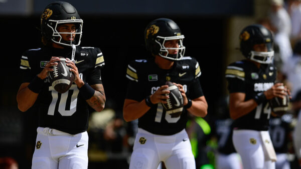 BOULDER, CO - SEPTEMBER 12:From left: Colorado Buffaloes quarterback Julian Lewis, quarterback Isaac Wilson and quarterback Kaneal Sweetwyne warm up before the game against the Weber State Wildcats at Folsom Field in Boulder on Saturday, Sept. 12, 2026.