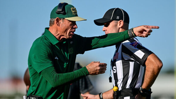 FORT COLLINS, COLORADO - OCTOBER 3: Head coach Jim Mora of the Colorado State Rams interacts with a referee during a game against the Oregon State Beavers at Canvas Stadium on October 3, 2026 in Fort Collins, Colorado.