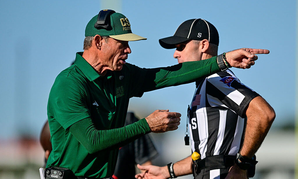 FORT COLLINS, COLORADO - OCTOBER 3: Head coach Jim Mora of the Colorado State Rams interacts with a referee during a game against the Oregon State Beavers at Canvas Stadium on October 3, 2026 in Fort Collins, Colorado.