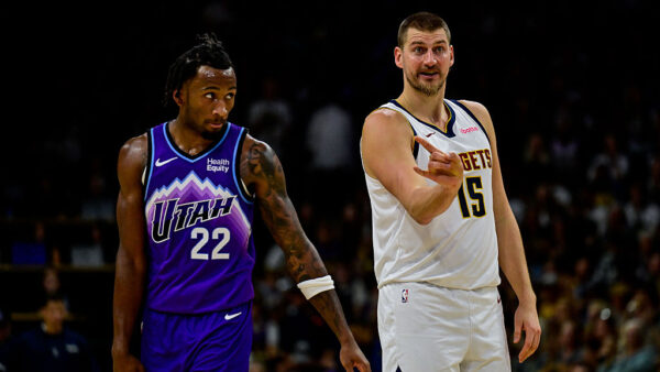 BOULDER, COLORADO - OCTOBER 4: Nikola Jokic #15 of the Denver Nuggets calls the play as Darryn Peterson #22 of the Utah Jazz looks on in the first half of a preseason game at CU Event Center on October 4, 2026 in Boulder, Colorado. NOTE TO USER: User expressly acknowledges and agrees that, by downloading and or using this photograph, User is consenting to the terms and conditions of the Getty Images License Agreement.