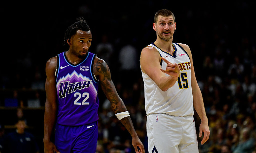BOULDER, COLORADO - OCTOBER 4: Nikola Jokic #15 of the Denver Nuggets calls the play as Darryn Peterson #22 of the Utah Jazz looks on in the first half of a preseason game at CU Event Center on October 4, 2026 in Boulder, Colorado. NOTE TO USER: User expressly acknowledges and agrees that, by downloading and or using this photograph, User is consenting to the terms and conditions of the Getty Images License Agreement.