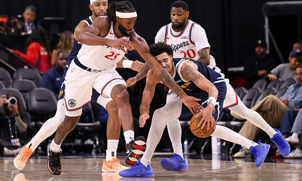 INGLEWOOD, CALIFORNIA - OCTOBER 14: Isaiah Jackson #23 of the Los Angeles Clippers and Julian Strawther #1 of the Denver Nuggets reach for the ball during the third quarter of a preseason game at Intuit Dome on October 14, 2026 in Inglewood, California. NOTE TO USER: User expressly acknowledges and agrees that, by downloading and or using this photograph, User is consenting to the terms and conditions of the Getty Images License Agreement.