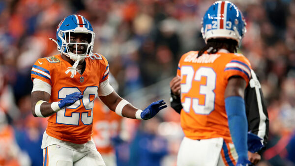 DENVER, COLORADO - OCTOBER 15: Ja'quan McMillian #29 of the Denver Broncos talks with Jahdae Barron #23 against the Seattle Seahawks during the third quarter of the game at Empower Field At Mile High on October 15, 2026 in Denver, Colorado.