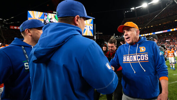 DENVER, COLORADO - OCTOBER 15: Head coach Sean Payton of the Denver Broncos shakes hands with head coach Mike MacDonald of the Seattle Seahawks after their overtime win in the game at Empower Field At Mile High on October 15, 2026 in Denver, Colorado.