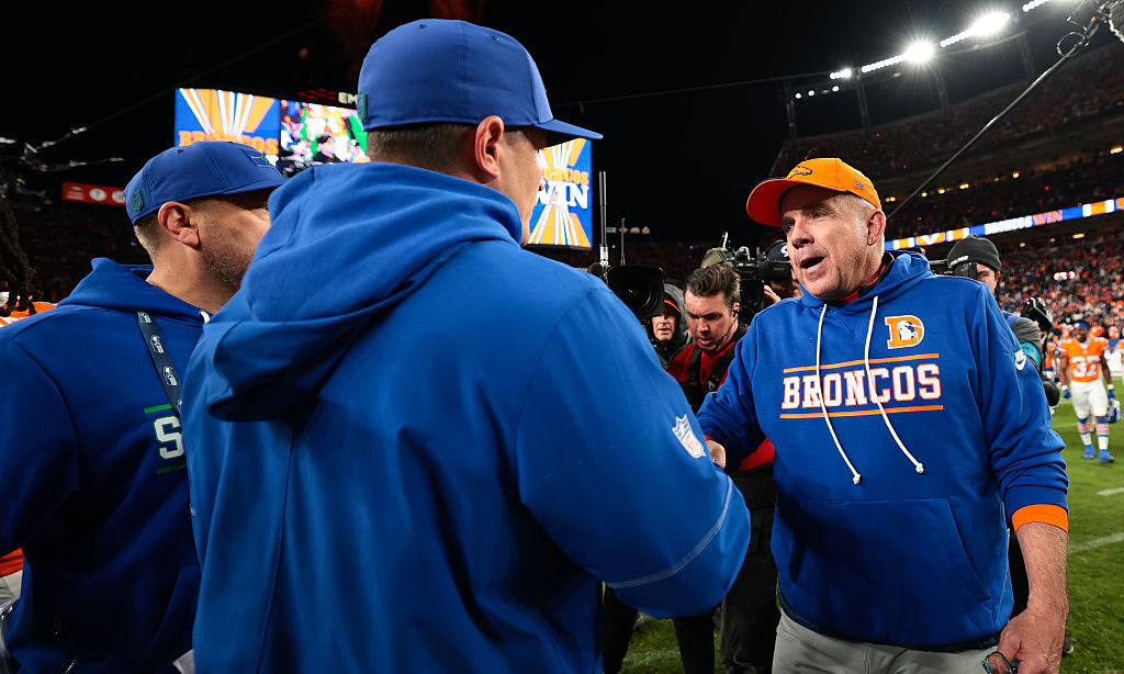DENVER, COLORADO - OCTOBER 15: Head coach Sean Payton of the Denver Broncos shakes hands with head ...