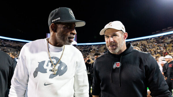 BOULDER, COLORADO - OCTOBER 17: Head coach Deion "Coach Prime" Sanders of the Colorado Buffaloes and Head coach Morgan Scalley of the Utah Utes shake hands after the game at Folsom Field on October 17, 2026 in Boulder, Colorado.