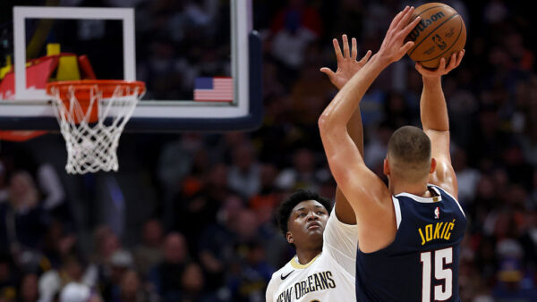 DENVER, COLORADO - OCTOBER 24: Nikola Jokic #15 of the Denver Nuggets puts up a shot against Derik Queen #22 of the New Orleans Pelicans during the first quarter at Ball Arena on October 24, 2026 in Denver, Colorado. NOTE TO USER: User expressly acknowledges and agrees that, by downloading and or using this photograph, User is consenting to the terms and conditions of the Getty Images License Agreement.