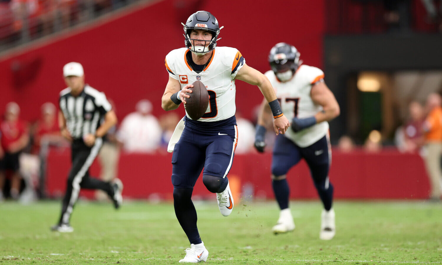 GLENDALE, ARIZONA - OCTOBER 25: Bo Nix #10 of the Denver Broncos runs for a touchdown during the se...